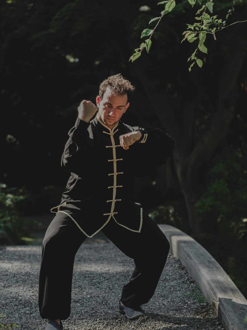 Alexander Litvinoff practicing an internal-arts standing posture outdoors in Vancouver