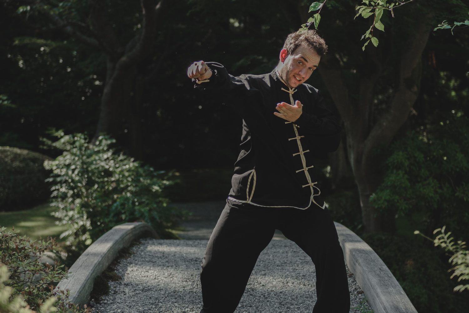 Alexander Litvinoff teaching an internal-arts movement outdoors in a Vancouver garden